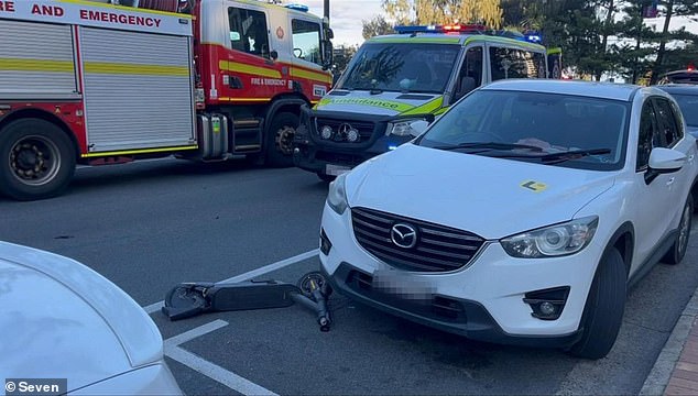 A 30-year-old woman on an e-scooter died on Thursday after being hit by a BMW in Surfers Paradise (the white car was not involved)