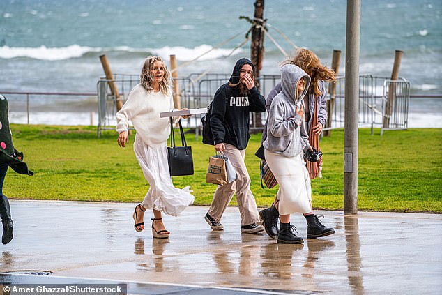 The heavy rains set to flood large parts of the country this week could herald the start of a wetter than average winter and spring for most Australians (people in Adelaide are pictured)