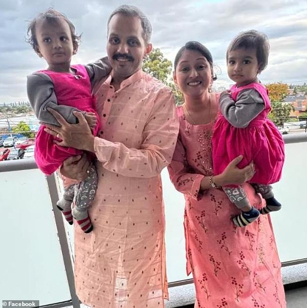 Pictured: Anand Runwal and his wife Poonam with their two-year-old twin daughters Hilal and Hiya