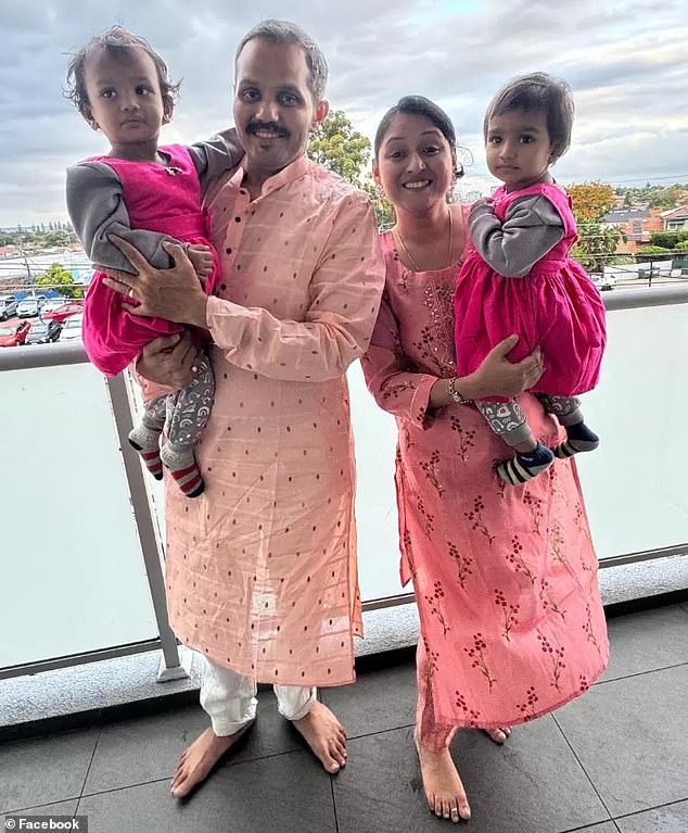 Anand Runwal (pictured with his family) died on Sunday along with one of his twin daughters after jumping onto the train tracks at Carlton Station to save them