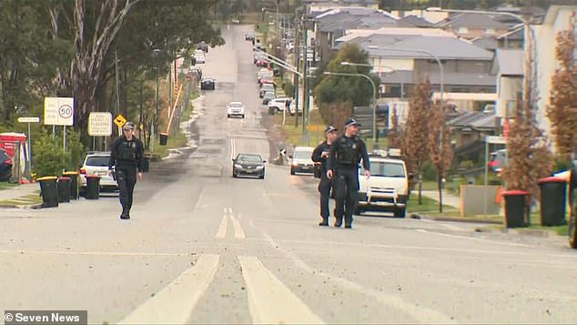 Police are on the scene in Austral in Sydney's southwest, where a barefoot trader chased an alleged gunman on Thursday night