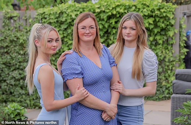 Nurse Helen Bone, 42, with daughters Livvy, 16, left, and Maddy, 13