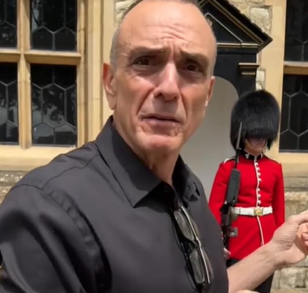 Hank Azaria (left), voice of a handful of Simpsons characters, tries to make the Royal Guard laugh at the Tower of London