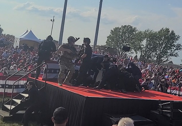 New footage shows the seconds after the chaotic shooting of former President Donald Trump before he is thrown from the stage