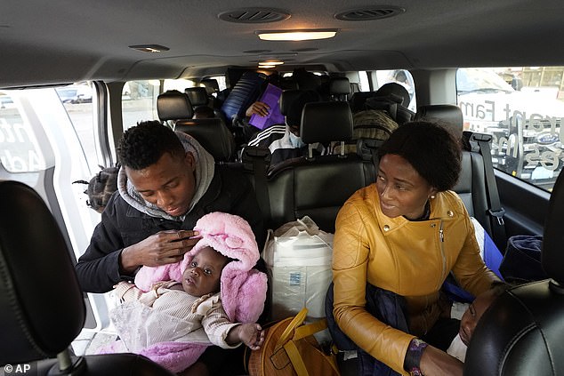 Migrants from Haiti and elsewhere board a van in Boston en route to a shelter in Quincy, Massachusetts