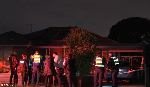 Police found an unconscious 36-year-old man with stab wounds at a house on Victoria Drive in Thomastown, in the city's north, at 8.40pm on Thursday (police can be seen at the house in the photo)