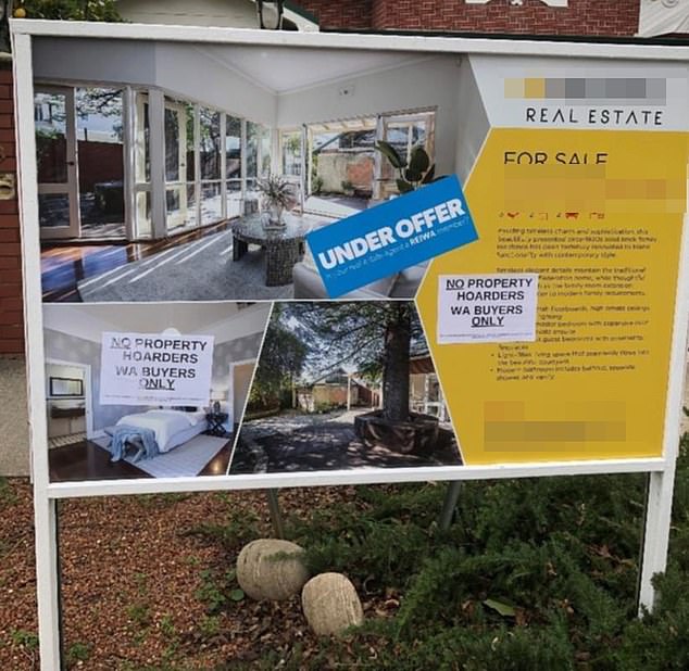 A Perth vandal has angered property investors from across the state by sticking a poster on a house's 'for sale' sign (pictured) saying 'WA buyers only'