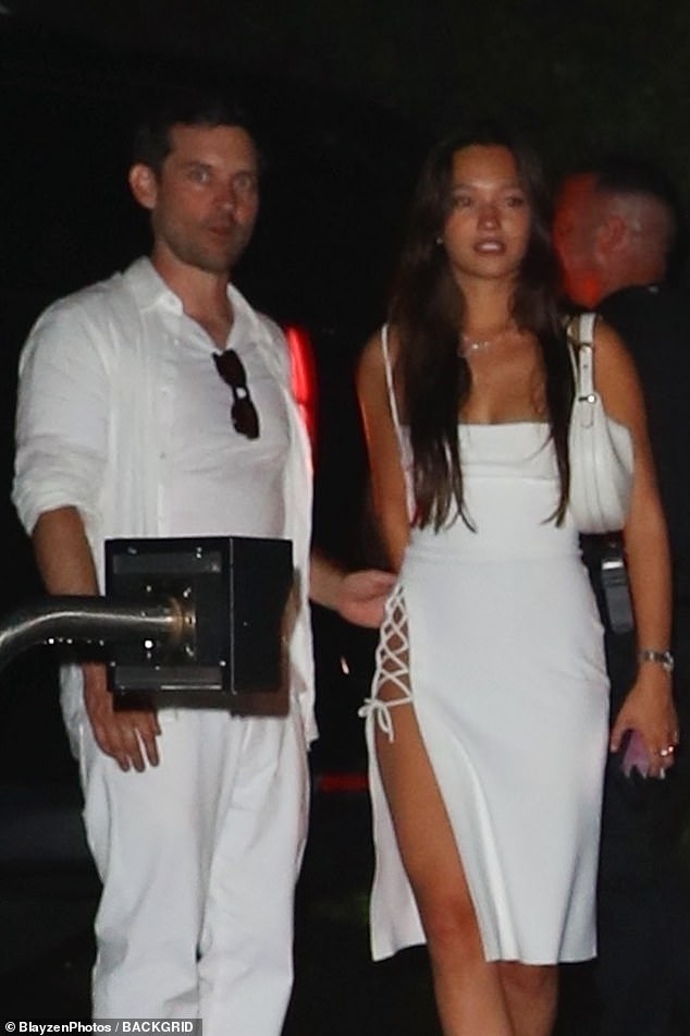 Tobey Maguire's ex-wife Jennifer Meyer, 47, appears to have shut down rumors that the Spider-Man actor, 49, is romancing model Lily Chee, 20. Pictured at a July 4 party known as the 'White Party' in the Hamptons in New York.