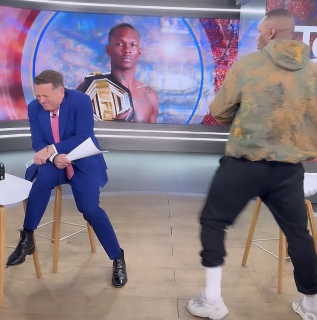Karl Stefanovic cowered in fear when New Zealand kickboxer Israel Adesanya pretended to attack him during his interview on the show