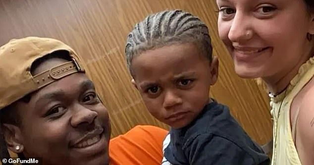 Nakyzi Odums, 2, (center) died Saturday in a hospital after accidentally shooting himself in the chest in a Walmart parking lot on July 3. The toddler is pictured with his parents Sam Odums (left) and Laileighauna Parks (right)