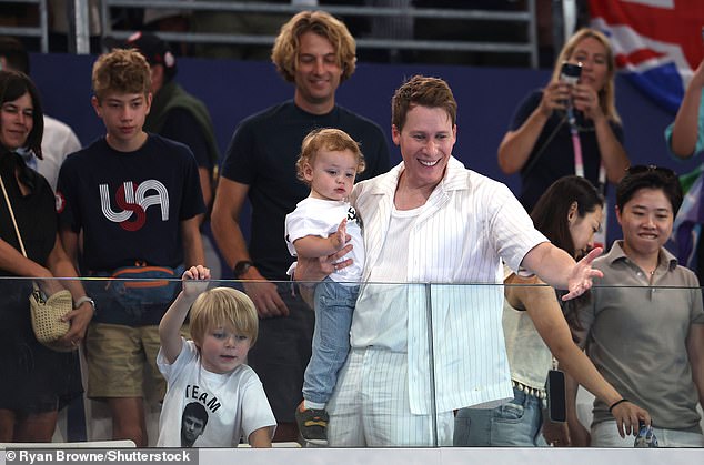 The diver won his fifth Olympic medal on Monday at the Games in Paris, as his husband Dustin Lance Black and sons Robbie, six, and Phoenix, 13 months, looked on.