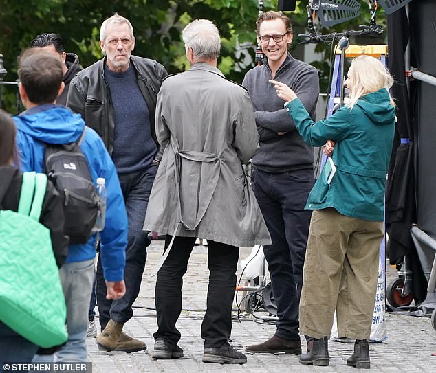 Tom Hiddleston reunited with his co-star Hugh Laurie to film the second series of The Night Manager in Richmond-upon-Thames on Wednesday