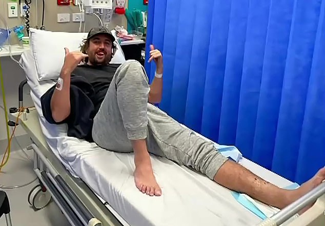 Ryan Lowther (pictured below in hospital) said the shark felt like 'a clamp of razor blades being stuck into his leg' when he was bitten at Trigg Beach