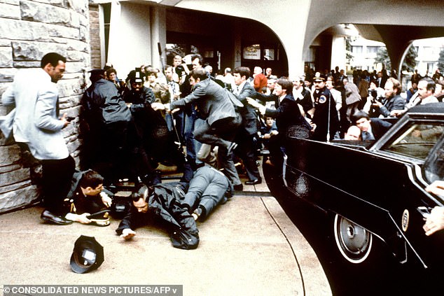 This photo, taken by presidential photographer Mike Evens on March 30, 1981, shows the response of police and Secret Service agents during the attempted assassination of then-U.S. President Ronald Reagan.