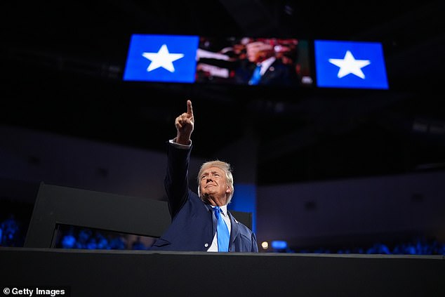 Republican presidential candidate, former U.S. President Donald Trump, points to the crowd as he arrives on the second day of the Republican National Convention at the Fiserv Forum on July 16, 2024 in Milwaukee, Wisconsin