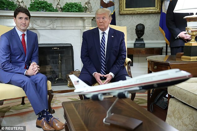 Then-President Trump with Canadian Prime Minister Justin Trudeau, seen with Trump's design for Air Force One - in the Oval Office in June 2019