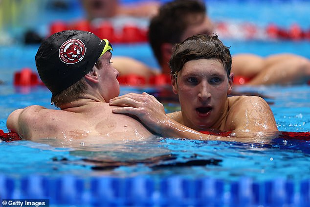 David Johnston and Luke Whitlock embrace after the men's 1500m freestyle in Indianapolis