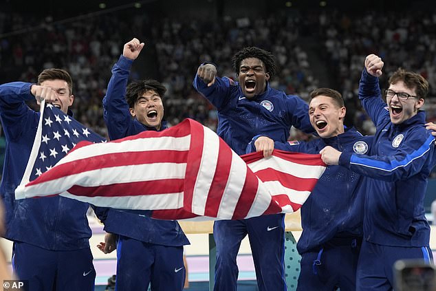 Brody Malone, Asher Hong, Fred Richard, Paul Juda and Stephen Nedoroscik celebrate winning a gold medal for Team USA on Monday