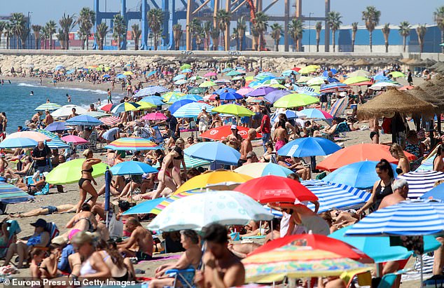 Sunbathers on one of the country's most famous beaches are falling victim to 'unlicensed parasols' which are now being confiscated