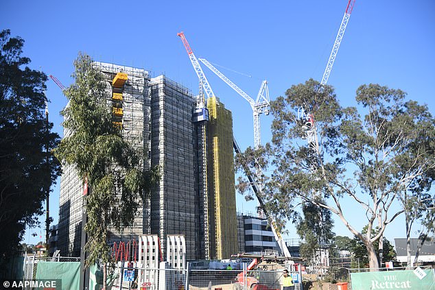 Anthony Albanese's plan to build 240,000 homes a year from this week could trigger an insolvency crisis in the coming years, an insider fears (pictured are apartments under construction in Sydney)
