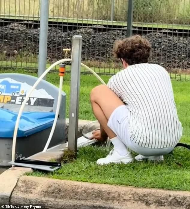 The camper was pictured washing his kitchen utensils with the downpipe, which is used to flush sewage from caravans and campers