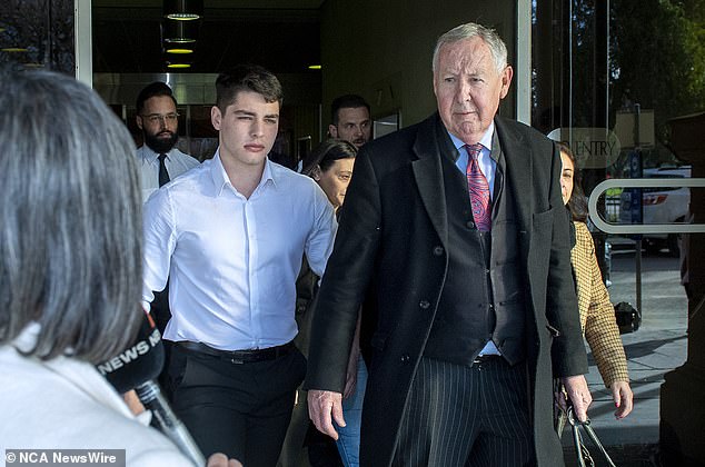 Marco Yandle, 20, (pictured left leaving the High Court with his lawyer Stephen Ey) was given a suspended sentence for his role in helping his father allegedly murder a homeless man on their family property