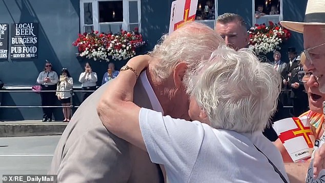 But the monarch may have gotten more than he bargained for when he greeted the public in the small town of St Peter Port in Guernsey on Tuesday. Cheeky 91-year-old local Kathleen Moriarty planted a kiss on the king's cheek, much to the delight of onlookers