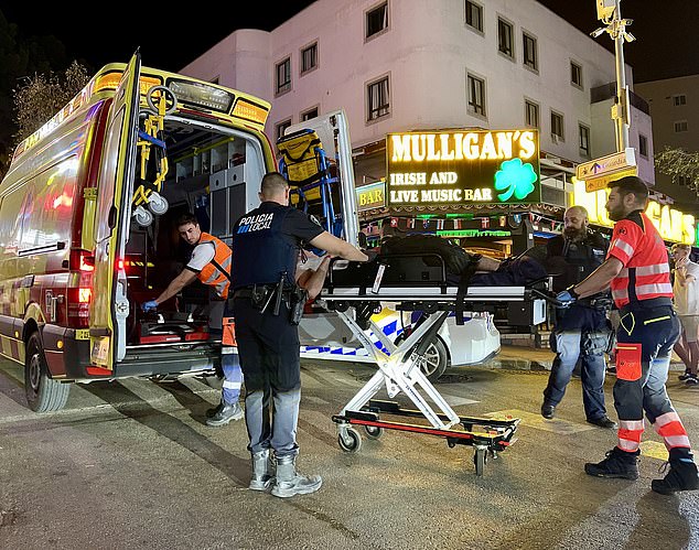 A British man in his 20s was found unconscious in the early hours of the morning on a street in Magaluf, outside the Irish pub Mulligan's - just metres from where an Irish father of four was found dead less than 24 hours ago, covered in bite marks.