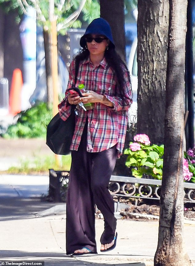 Zoe Kravitz, 35, looked casual in a flannel shirt and navy bucket hat on Saturday in New York