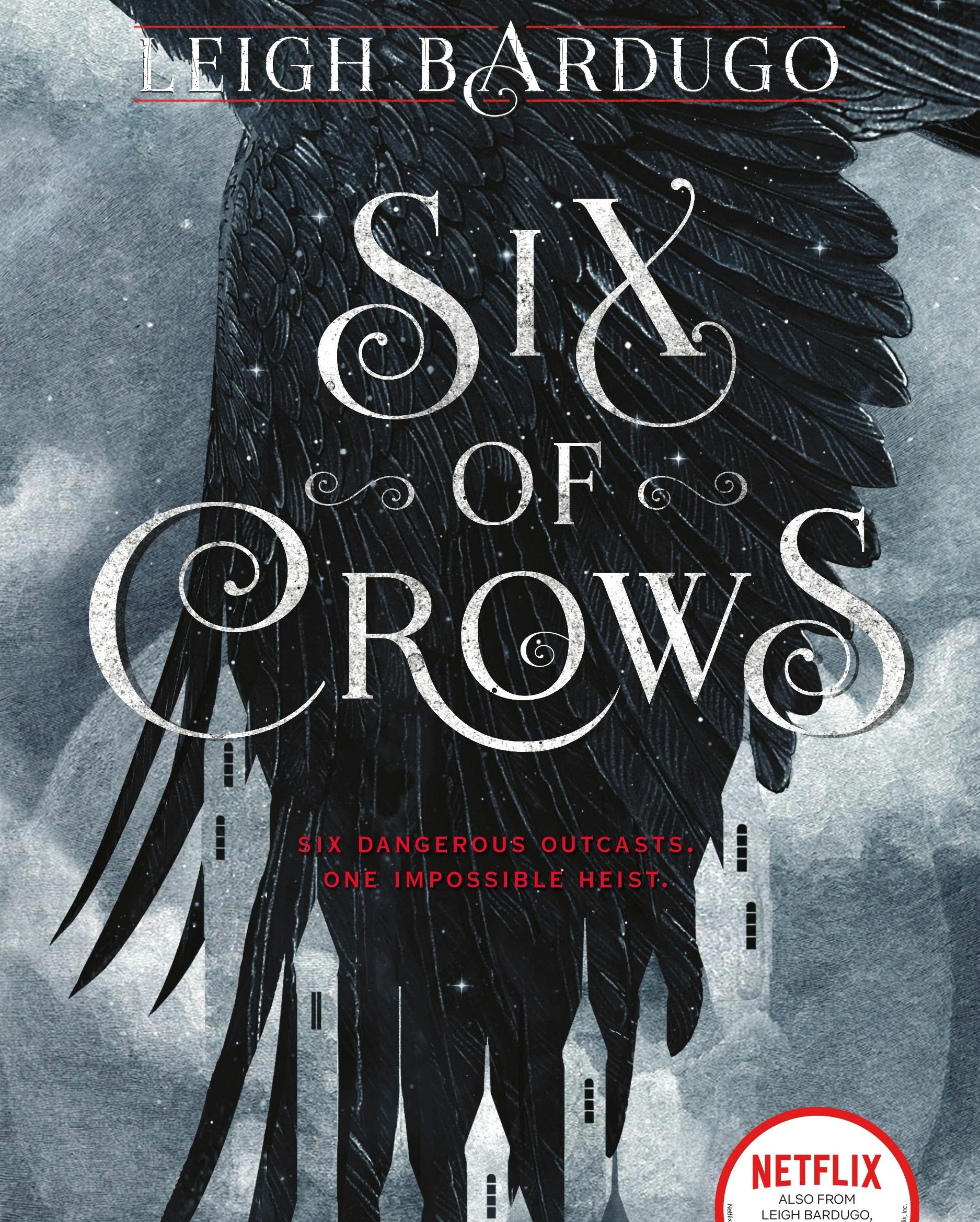 The cover of Six of Crows, featuring a black crow's wing behind the title