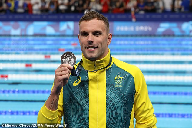 The Chinese star set a stunning world record by finishing one second ahead of Chalmers (pictured with his silver medal), but the Australian later said he was confident no doping was involved in the incredible swim.