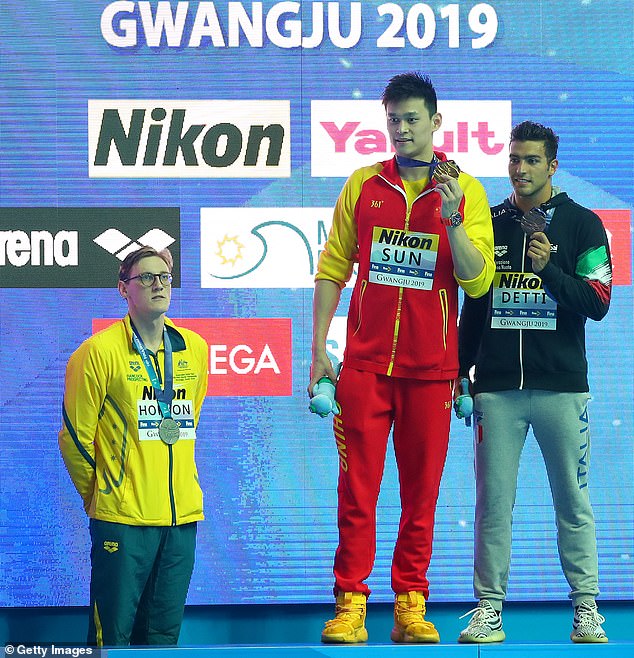 Mack Horton (left) refused to take the stage after being defeated by controversial Chinese star Sun Yang (center) in 2019