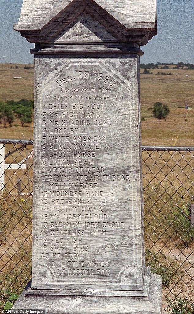 This August 2001 photo shows a monument at the cemetery of the Lakota Indians killed in the December 29, 1890 massacre.