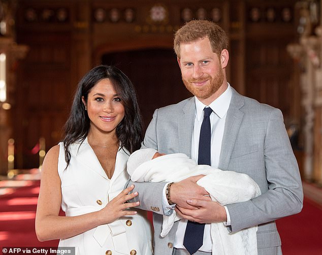 Prince Harry and Meghan with Archie in May 2019, when a newborn son