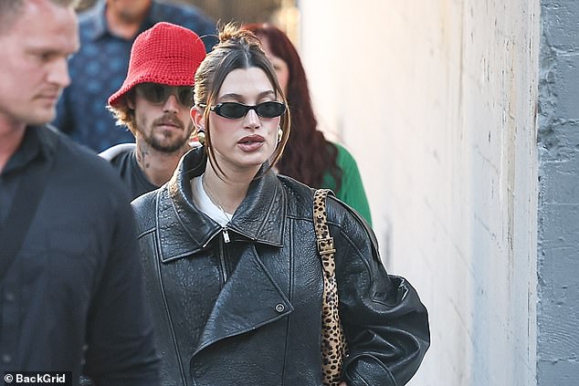 She completed her look by pulling her brunette locks into a bun that was held together with a large black hair clip, though she left her hair hanging loosely to frame her face