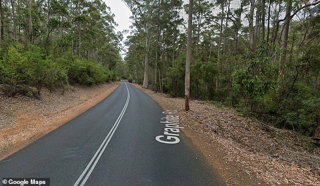 Police are investigating the scene of the accident on Graphite Road. A local resident says the trees have not been kept under control and are a hazard in the wild weather.