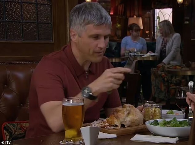 The character was in the process of eating what appeared to be a whole chicken, presented on a cutting board