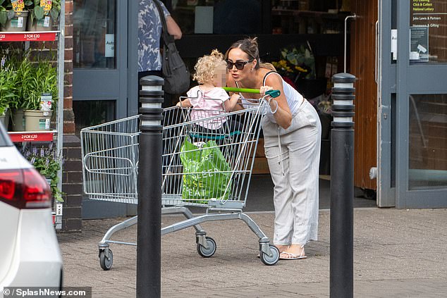 Lauryn looked casual in a white cardigan and linen trousers as she headed to Waitrose supermarket in Brighton to do her shopping