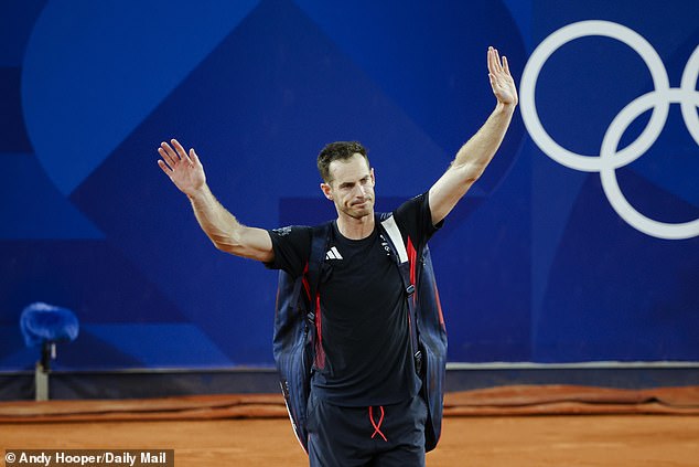 An emotional Murray is pictured waving as he leaves the field after the final game of his career