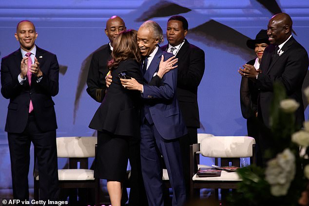 The Washington Post spoke to several people who were on the plane at the time, including civil rights leader Al Sharpton, who was seated to Biden's right. He is seen here shortly afterward in Houston with Harris, whom Biden said he holds no grudge against.