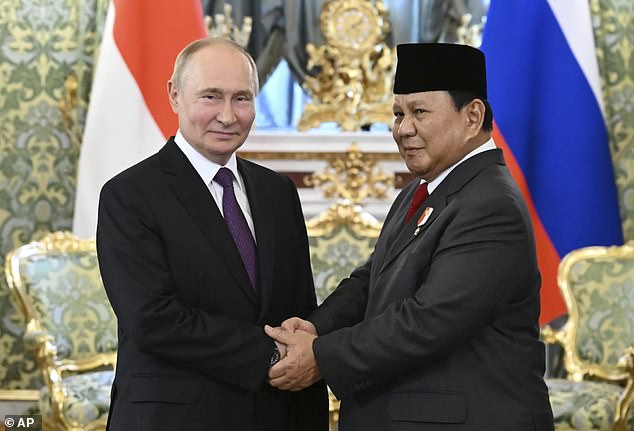 The request was made as part of the mandatory forms Gershkovich filled out as part of his request for presidential clemency from Vladimir Putin, pictured with Indonesian Defense Minister and President-elect Prabowo Subianto on Wednesday