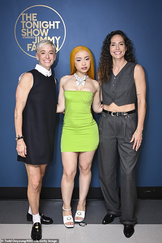 She also showed off her figure in a lime green sleeveless dress while posing backstage at the Jimmy Fallon show; pictured with Megan Rapinoe and Sue Bird on July 26