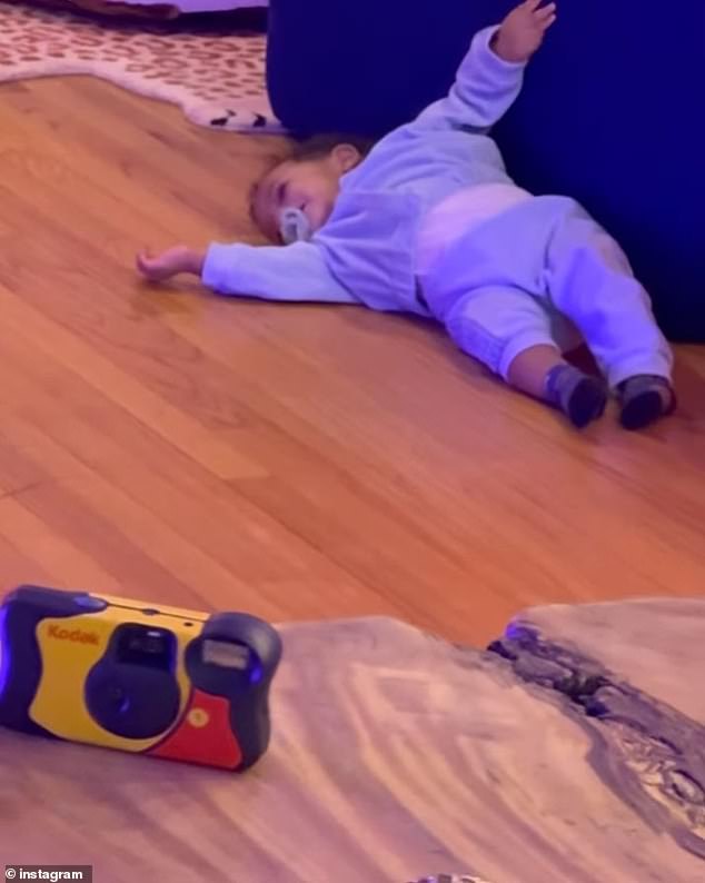 And last but not least, Riot looked absolutely adorable in a video that saw him relaxing on the floor of his and his brother's messy playroom in a blue onesie