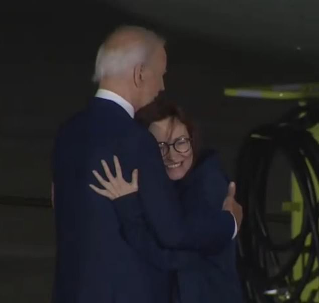 She was also seen hugging the president after briefly speaking with him and Harris