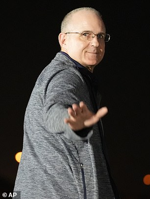 Vice President Kamala Harris, right, looks at Paul Whelan at Andrews Air Force Base, Maryland, after his release as part of a prisoner swap between Russia and the United States.