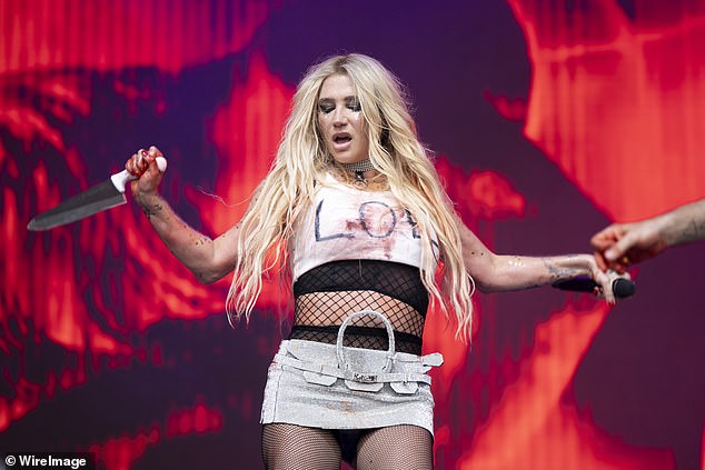 Kesha, 37, also wore her now iconic 'LOL' tank top, which many believe is a subtle dig at Katy Perry after she collaborated with Dr. Luke on new music