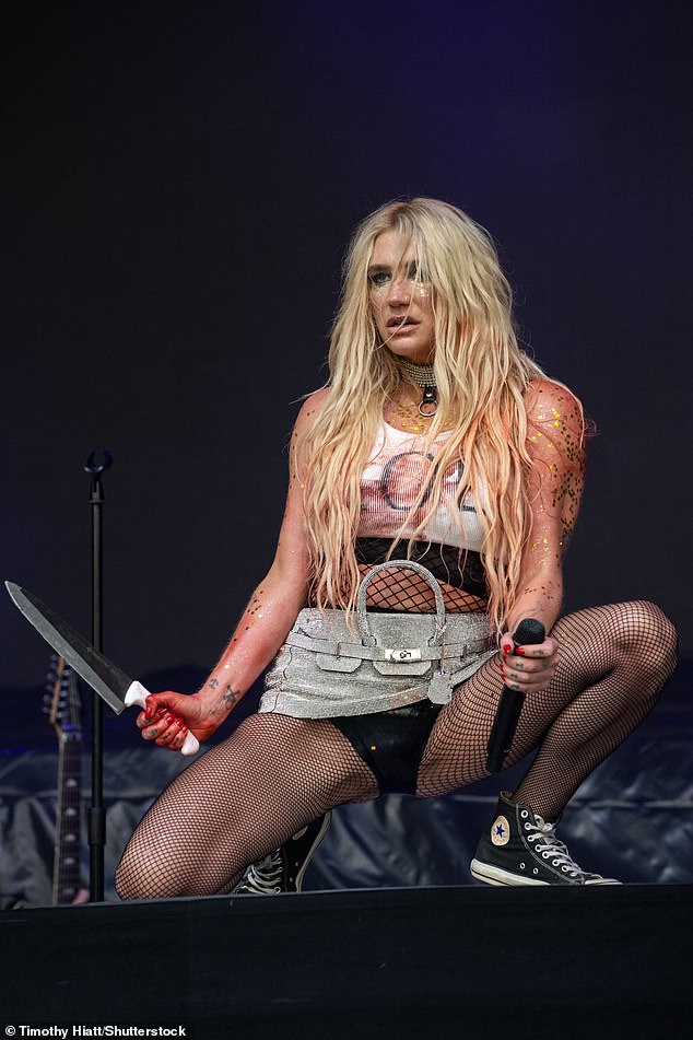 The singer-songwriter styled her bloody 'LOL' tank top with a sparkly mini skirt that was meant to look like a deconstructed Birkin bag