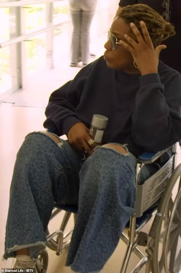 The 56-year-old singer was pushed to the emergency room in a wheelchair after complaining of shortness of breath