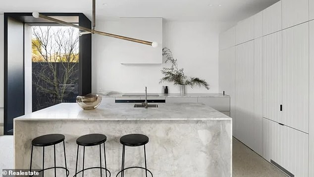 The Brunswick West property features lavish high ceilings, a patterned floor that combines both concrete and oak designs and beautiful north-facing windows with picturesque views