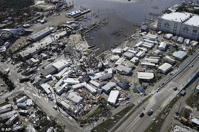 Damaged boats lie on land and water after Hurricane Ian, Thursday, Sept. 29, 2022, in Fort Myers, Florida.